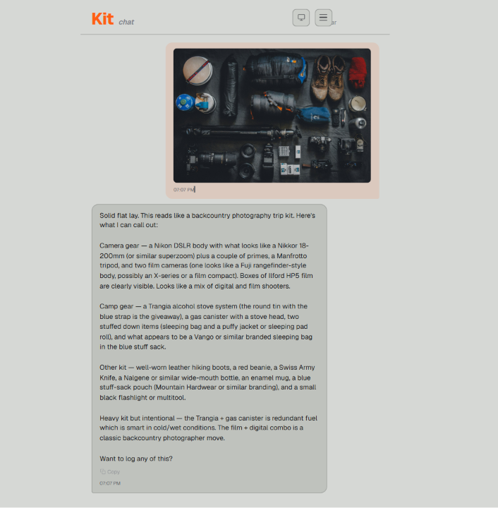 Kit chat identifying a backcountry photography flat lay from a single photo: a Nikon DSLR with an 18-200mm zoom and primes, two film cameras with Ilford HP5, a Manfrotto tripod, a Trangia stove, hiking boots, a Swiss Army Knife, and more, plus a read on which choices are intentional